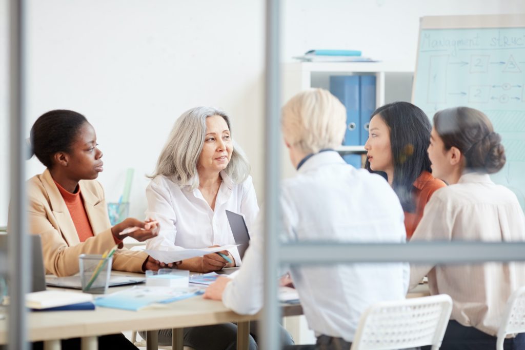 Female Business Team Meeting in Conference Room