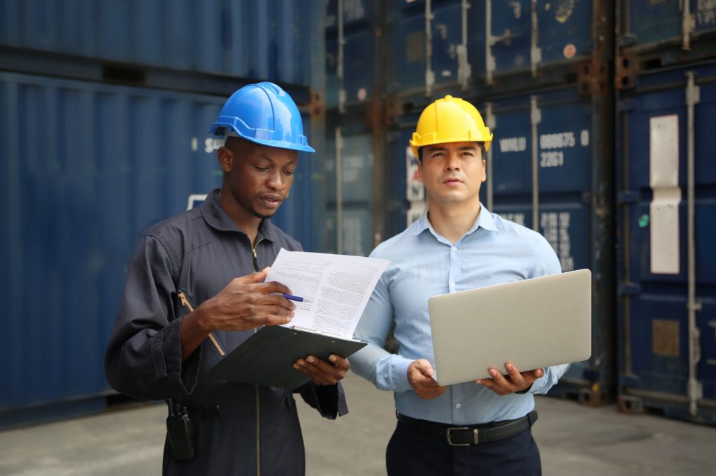 Professional engineer staff team checking and inspect container for international business logistic