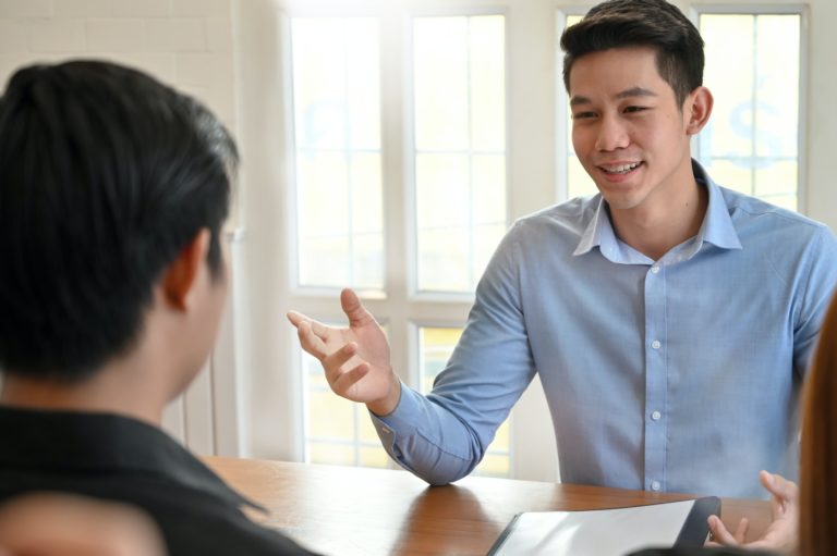Young man talking with interview job in modern office.