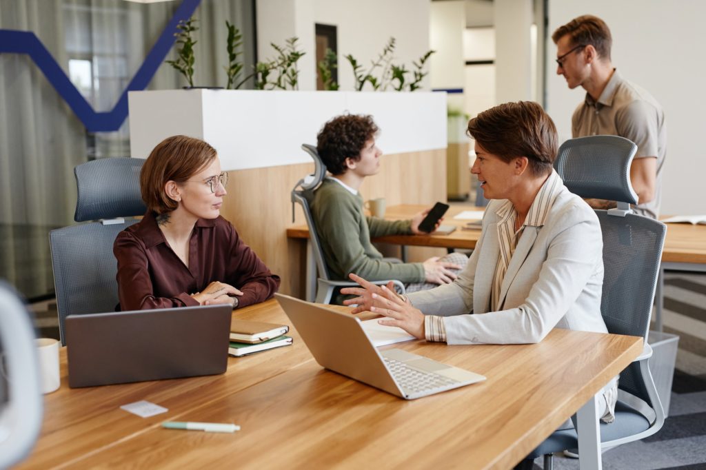 Business Mentor Talking to Employee